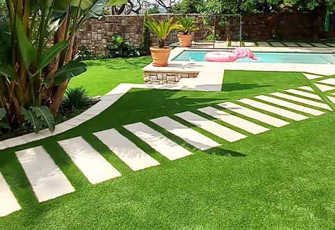 easigrass jhb north artificial grass installation around pool with stepping tiles