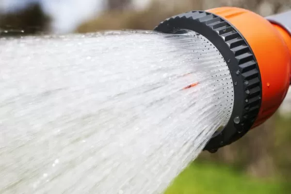 water hose spraying deep clean